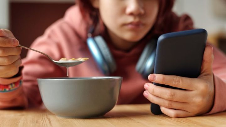 Parents are on devices during meals even more than their kids. Here’s how to rethink family dinner