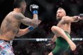 Conor McGregor suffers early injury in return and loses to Max Holloway at UFC 329